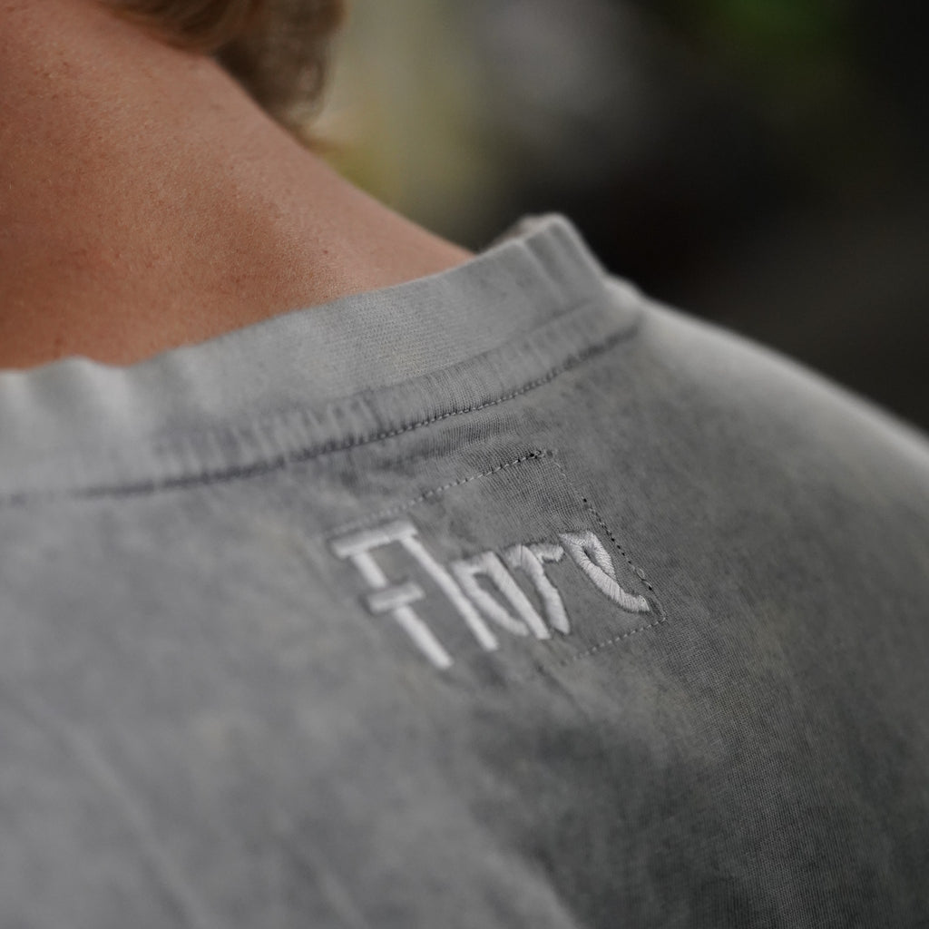 Close-up of the white Flare embroidery at the back neck