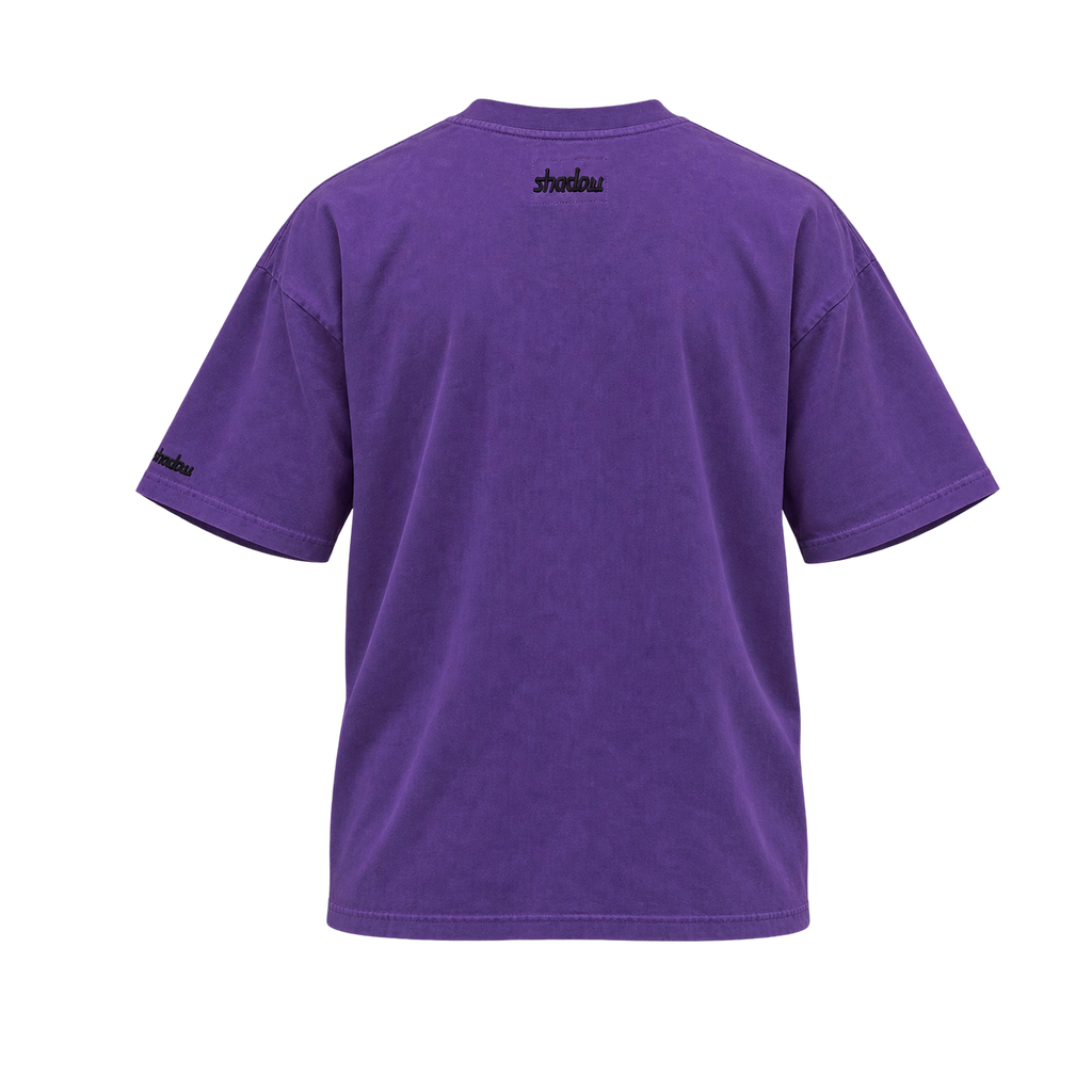Shadow tee in washed purple, back view with shadow embroidery below the collar