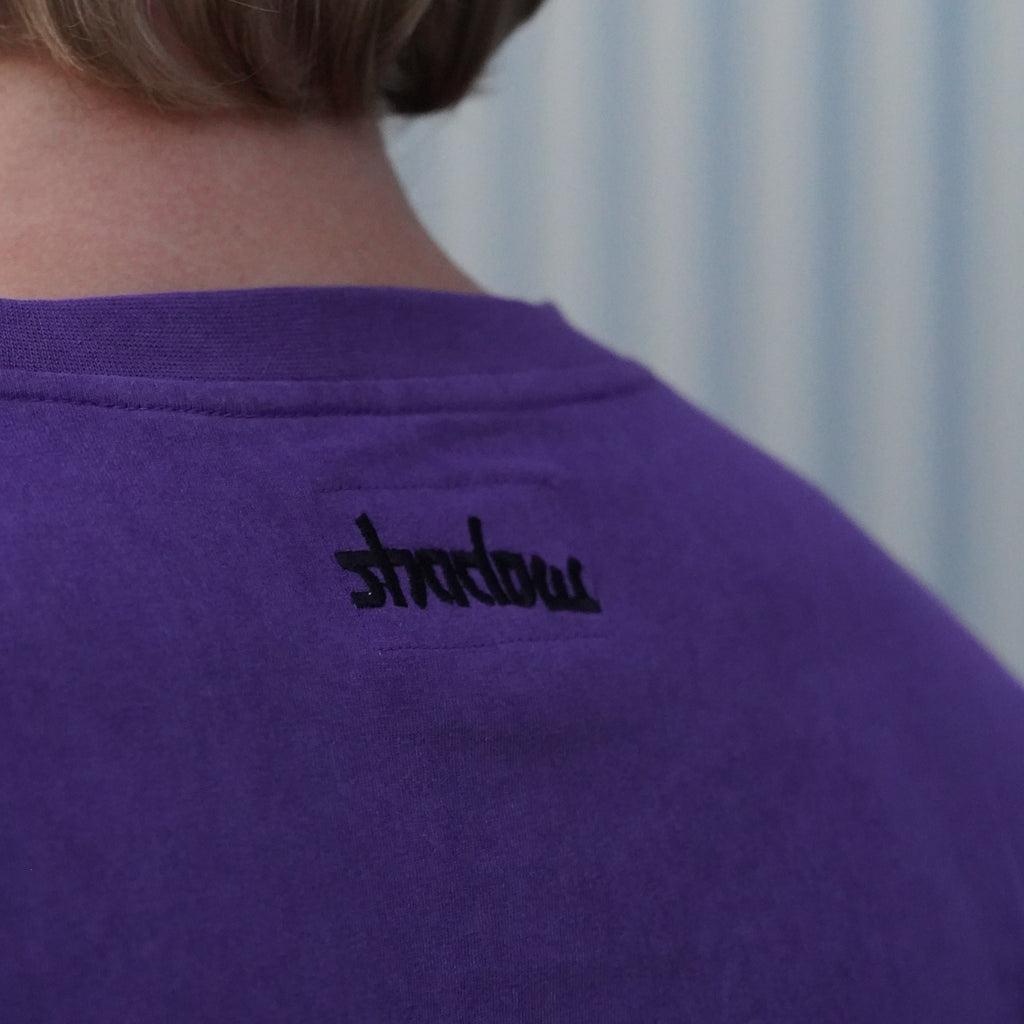 Close-up of the black shadow embroidery at the back neck
