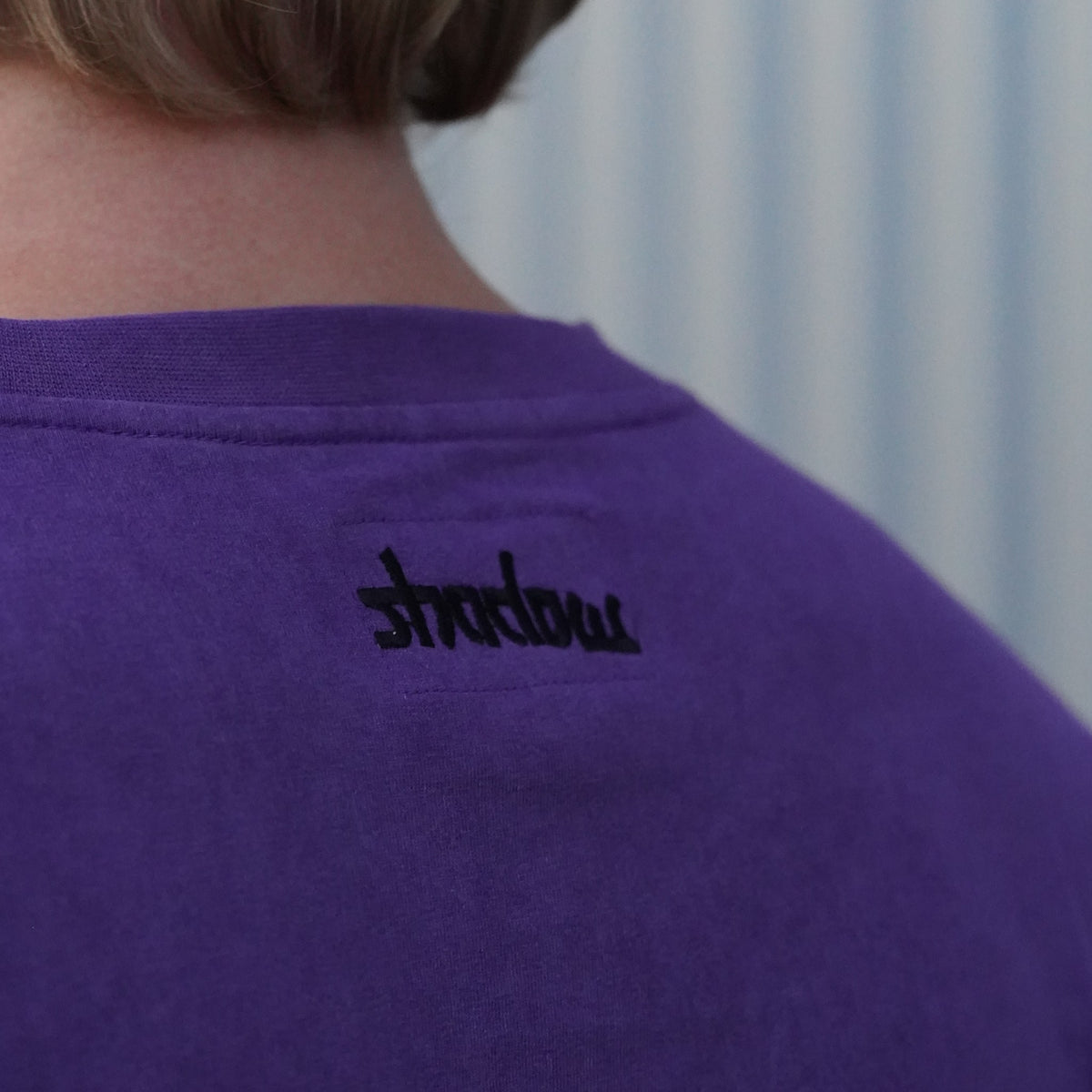 Close-up of the black shadow embroidery at the back neck