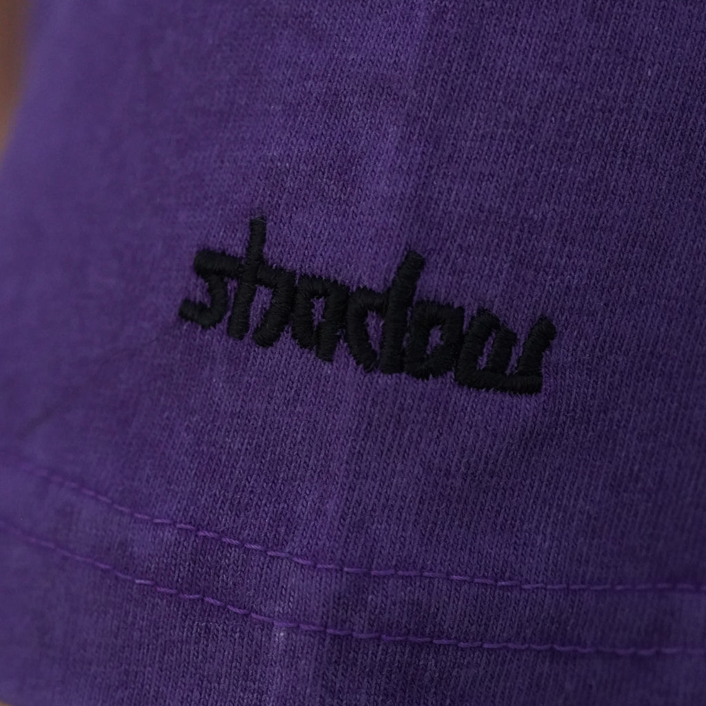 Close-up of the shadow embroidery on the sleeve of the Shadow tee